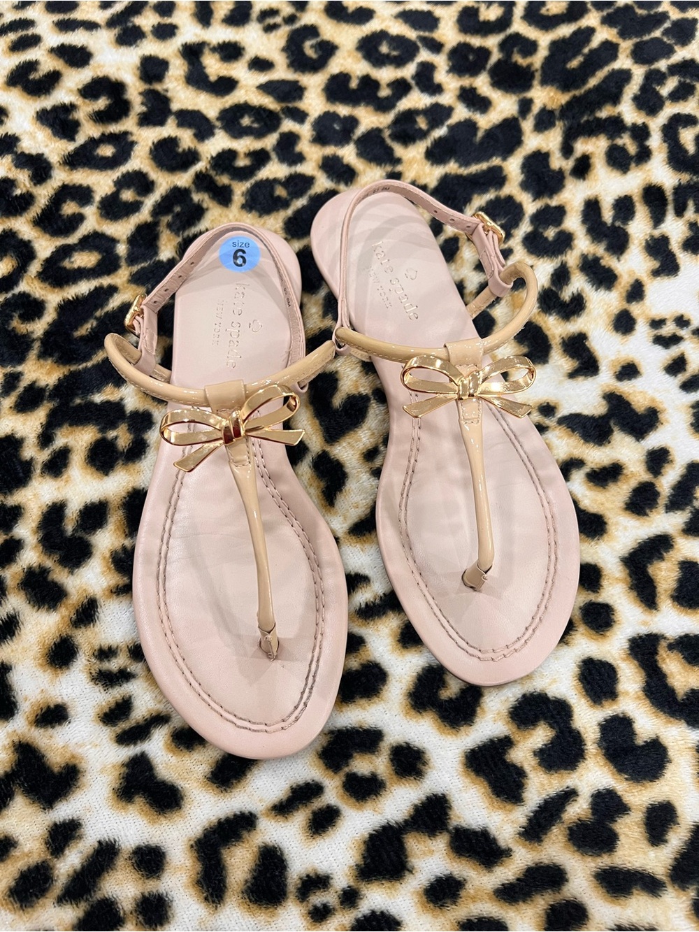 kate spade Light Beige T-Strap Sandals with Gold Bow Accent